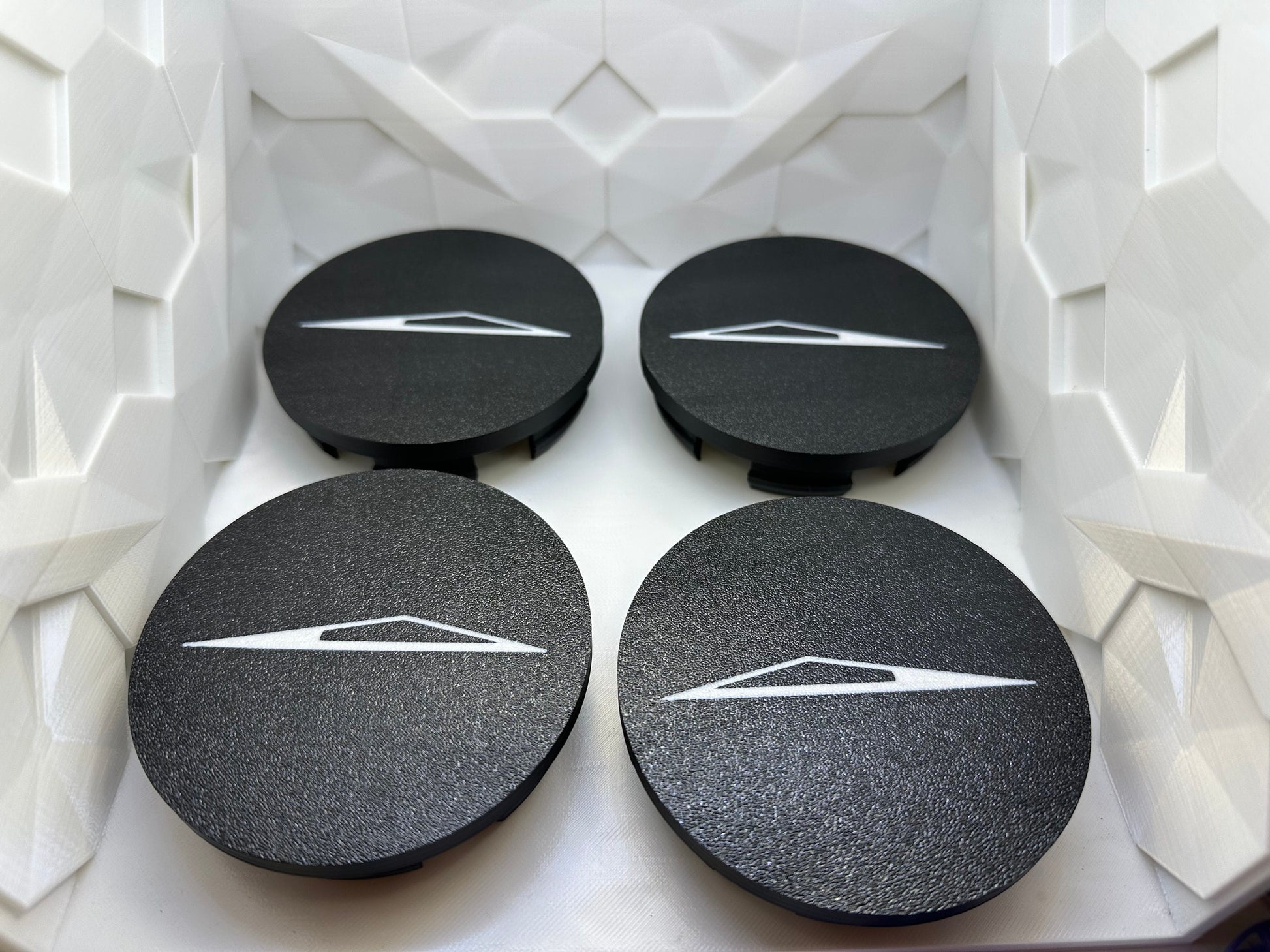 CyberTruck wheel center caps Left & Right side. Logo facing forward on both sides. Lug Nut Caps Optional Foundation Series